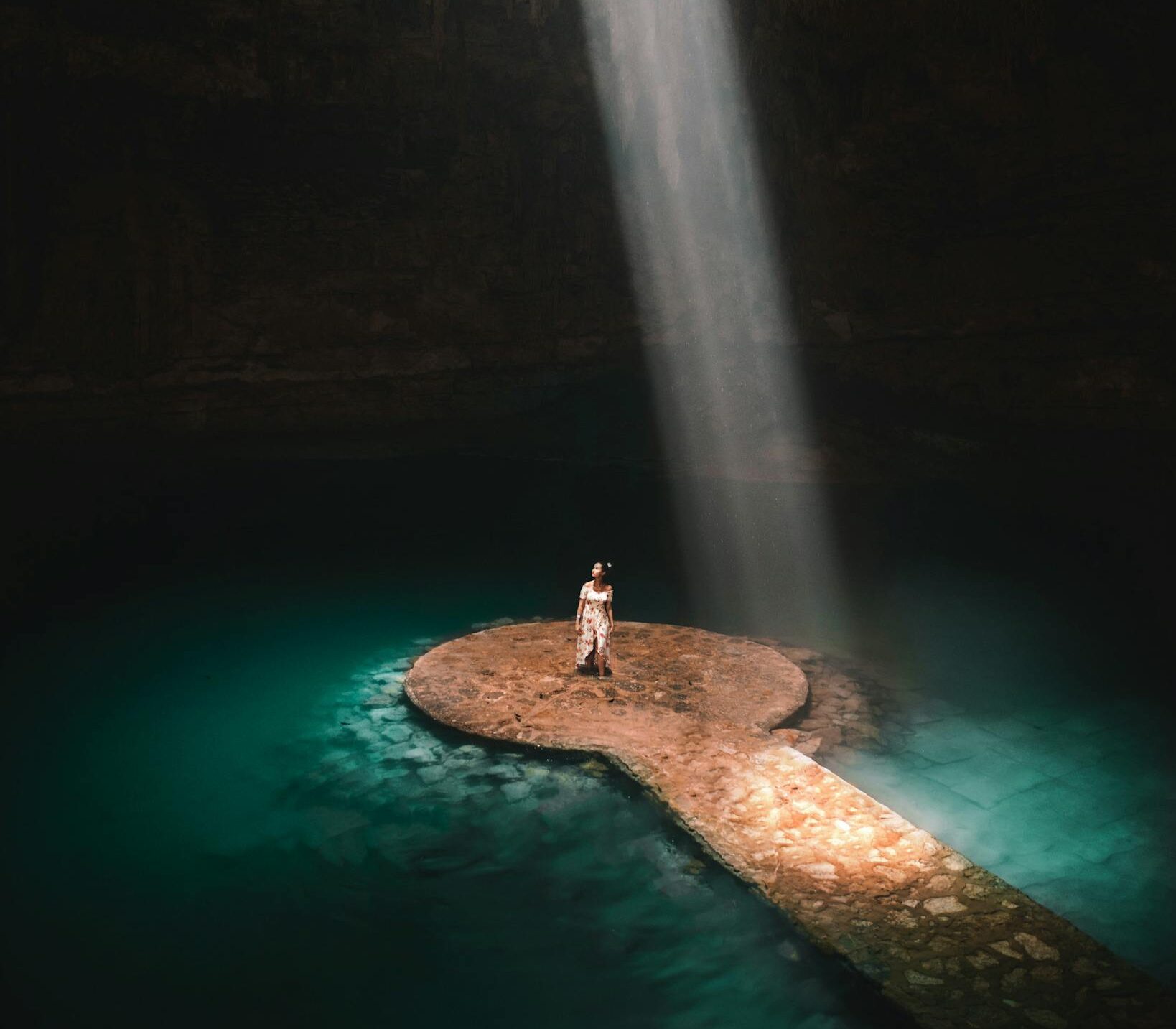 Woman Standing Inside the Cenote Suytun in Mexico 